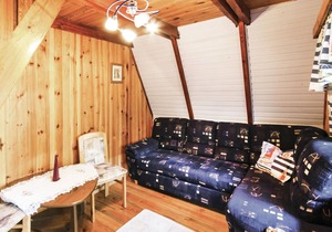This cottage is located on a small hill, directly on the lake with its own jetty.