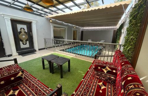 Al Aqiq Ski Chalet | شاليه وحديقة التوت بمسبح