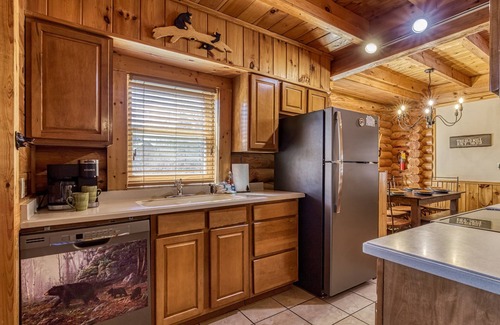 Pigeon Forge House | 1 mile from Pigeon Forge log cabin Townhouse has hot tub with indoor and outdoor pool sleep 8