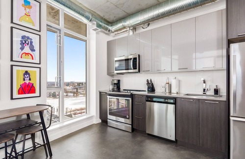 Bridgeland Condo | 2 Bedroom Downtown Executive Suite with Endless River View | Rooftop Patio