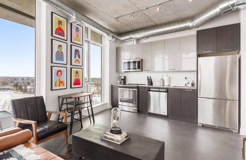 Bridgeland Condo | 2 Bedroom Downtown Executive Suite with Endless River View | Rooftop Patio