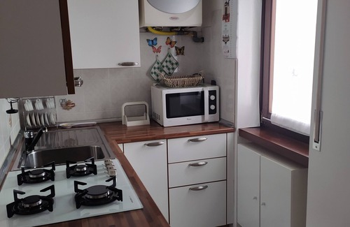 Riva del Garda Apartment | 2 min from the historic center. Small apartment in quiet area with balcony.