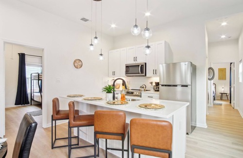 Near East Side Apartment | 3BR-2BA Cityscape Haven with Panoramic Tower View!