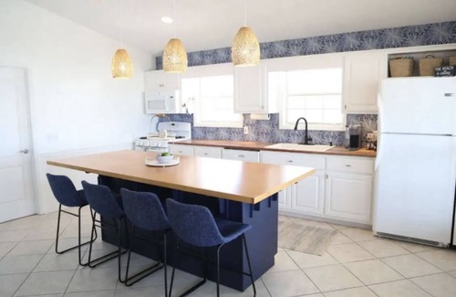 Riviera Beach House | 4-bedroom house, Heated Pool, Hot Tub, 6 person Golf Cart. 2 blocks from beach.