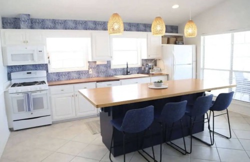 Riviera Beach House | 4-bedroom house, Heated Pool, Hot Tub, 6 person Golf Cart. 2 blocks from beach.