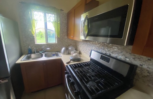Saint Andrew Apartment | 5 minutes away fom PriceSmart! Pet-Friendly Cozy Studio with warm water