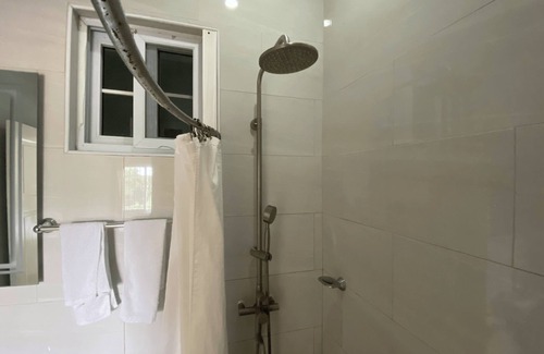 Saint Andrew Apartment | 5 minutes away fom PriceSmart! Pet-Friendly Cozy Studio with warm water