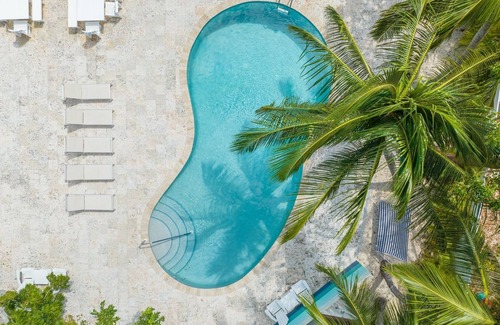 West Bay Condo | 7 Mile Beach Private Beach Club. Ocean views from Roof Terrace and Pool Pavilion
