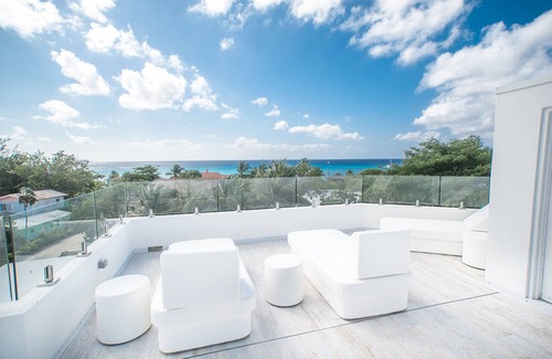 West Bay Condo | 7 Mile Luxury Beach Club. Ocean views from Roof Terrace and Pool Pavilion.