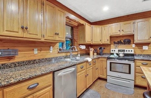 Tomball Cottage | 8 acres of fun & relaxation in a beautiful Rock Cottage with a pool and hot tub