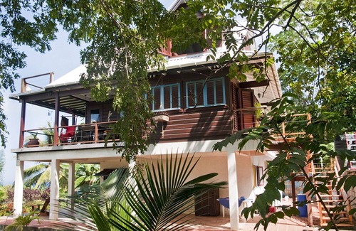 Ragged Point House | A beautiful wooden house built among the trees with views of the Atlantic coast