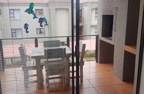 Hartenbos House | A comfortable livingroom, fully equipped kitchen make you feel at home apartment