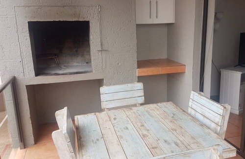 Hartenbos House | A comfortable livingroom, fully equipped kitchen make you feel at home apartment