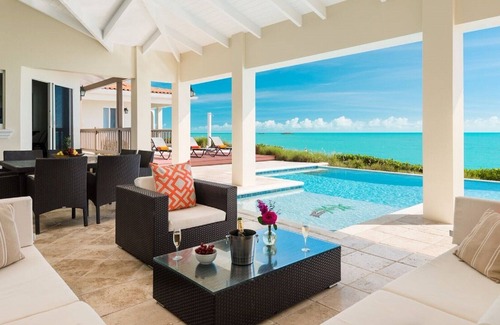 Venetian Road Settlement Villa | A Palm Tree Paradise at This Wonderful Oceanfront Villa