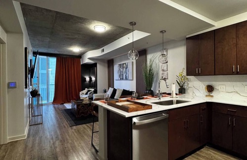 Midtown Apartment | A Place of Peace: Discover serene comfort in a peaceful retreat! This centrally located property provides easy access to top corporations, popular attractions, stadiums, & dining hotspots.