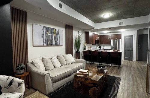 Midtown Apartment | A Place of Peace: Discover serene comfort in a peaceful retreat! This centrally located property provides easy access to top corporations, popular attractions, stadiums, & dining hotspots.