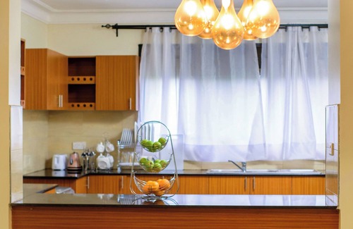 Entebbe Apartment | A spacious greenery hideout with a botanical garden view