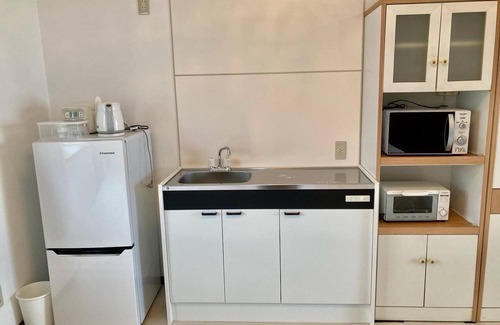 Hamada House | A triple room with a spectacular oceanfront view sunset right in front of you and plenty of amenit/Hamada Shimane