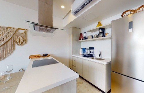 Zama Apartment | Aldea Zama condo with rooftop pool, private balcony, & great location