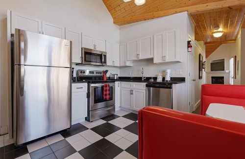 Helen House | Alpine River Suites #504 - Coca-Cola-Themed River Condo in Downtown Helen