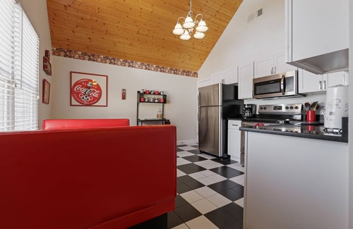 Helen House | Alpine River Suites #504 - Coca-Cola-Themed River Condo in Downtown Helen