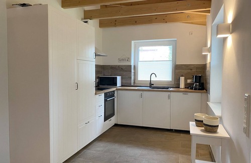 Pilsum Apartment | "Ankerplatz" vacation apartment with large garden in the heart of Pilsum