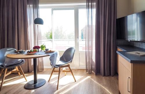 Spiekeroog Apartment | Antares Spiekerooger Gästehaus-Sonnengartenterrasse Süd - Wohnung 3