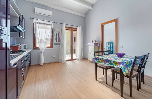 Sant'Antioco Apartment | Apartment 'Di Pina' with Private Terrace, Shared Garden and Air Conditioning