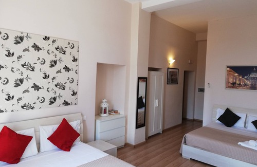 Esquilino Bed & Breakfast | Aria Rome Rooms quadruple room with balcony overlooking Basilica di San Giovanni