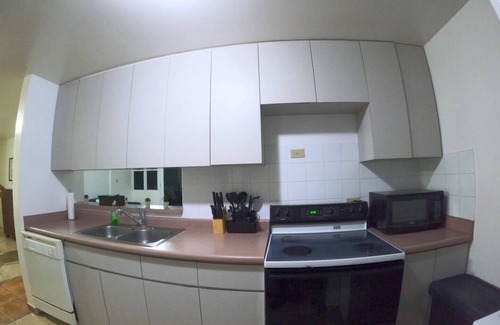 Guanajibo Apartment | Beachfront Apartment in Joyuda With Pool and Basketball Court