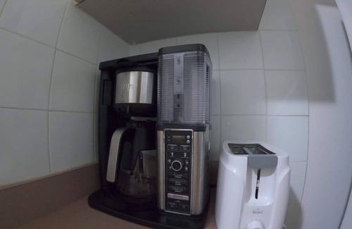 Guanajibo Apartment | Beachfront Apartment in Joyuda With Pool and Basketball Court