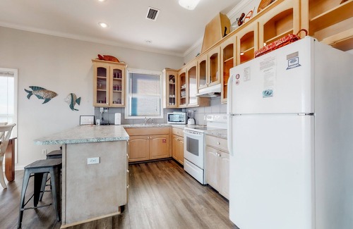 Plantation House | Beachfront dog-friendly home with private hot tub, boardwalk, on-site pools, gym