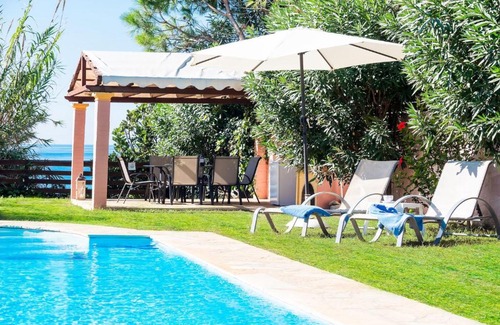 Agios Matthaios Villa | Beachfront Villa Rania by PosarelliVillas