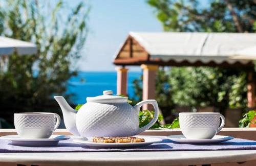 Agios Matthaios Villa | Beachfront Villa Rania by PosarelliVillas