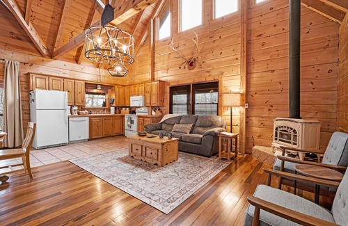 Gatlinburg - Pigeon Forge Cabin | Beautiful cabin nestled among the trees, featuring a loft and relaxing hot tub.