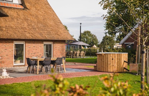 Zuna Cabin | Beautiful nostalgic holiday farm with modern bathroom and characteristic living room.
