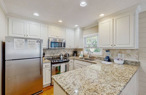 Pelican Bay House | Beautifully decorated cottage steps from the beach with pool & open layout