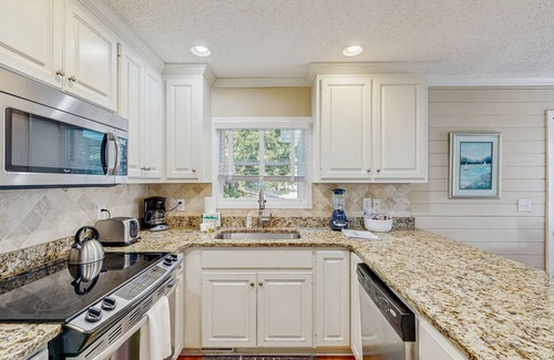 Pelican Bay House | Beautifully decorated cottage steps from the beach with pool & open layout