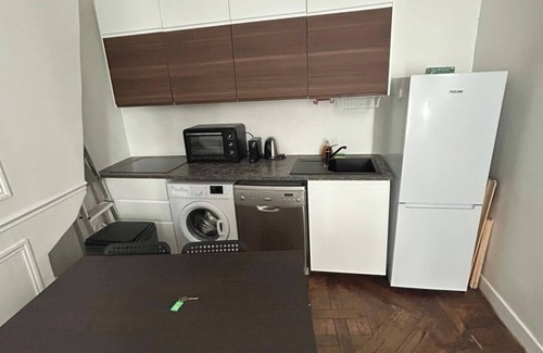 Saint-Gervais Apartment | BnBNook - Parisian Charm: 1BR in Le Marais
