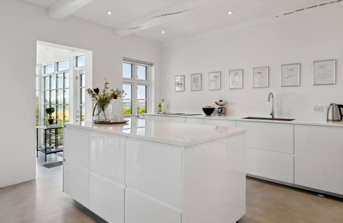 Assens House | Bright and modern vacation home in a prime location directly on the water.