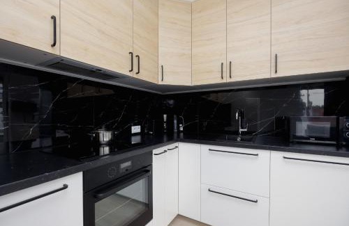 Warsaw Apartment | Bright & Modern Apartment with Balcony in Bemowo District by Noclegi Renters