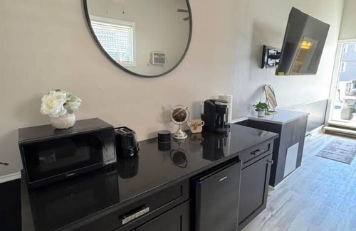 Osage Apartment | Bright & Stylish studio featuring an open layout, sleek finishes & fully furnished comfort.