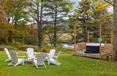 Johnson House | Caboose Tiny Home on river with hot tub near Stowe