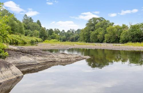 Johnson House | Caboose Tiny Home on river with hot tub near Stowe
