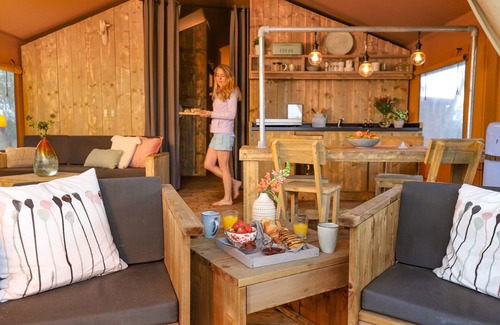 Bant RV Rental | Campsite - Combined Tents With Kitchen and Bathroom Located Near a Pond