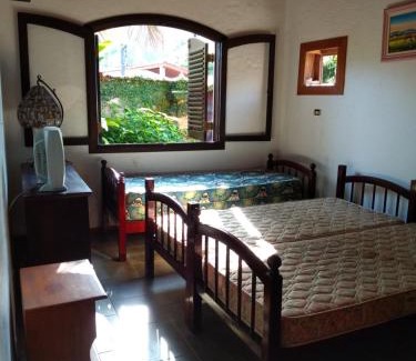 Pereque House | Casa com piscina em condomínio fechado no Guarujá