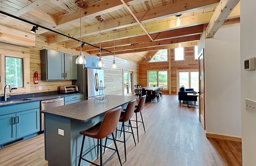 Waterfront Greens House | Casamigos | Newly Built Log Cabin + Private Hot Tub in Gated Community