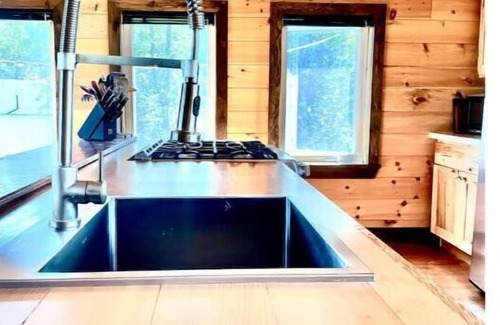 Britt Cottage | Cathedral pine cabin on the river, Open concept