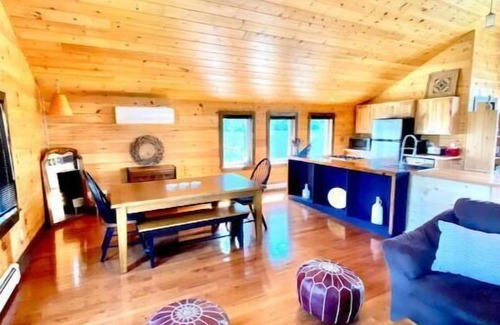 Britt Cottage | Cathedral pine cabin on the river, Open concept