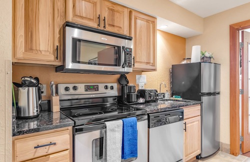 Wisconsin Dells Condo | Centrally located condo with balcony, fireplace, and AC - water views